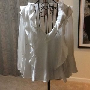White blouse ruffle sleeve.